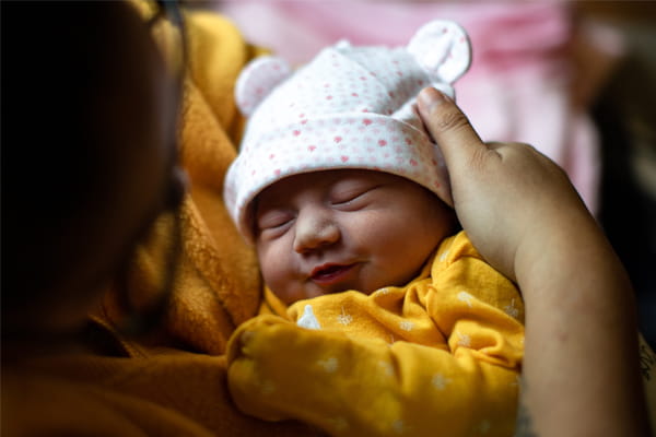 Mom holding Infant image
