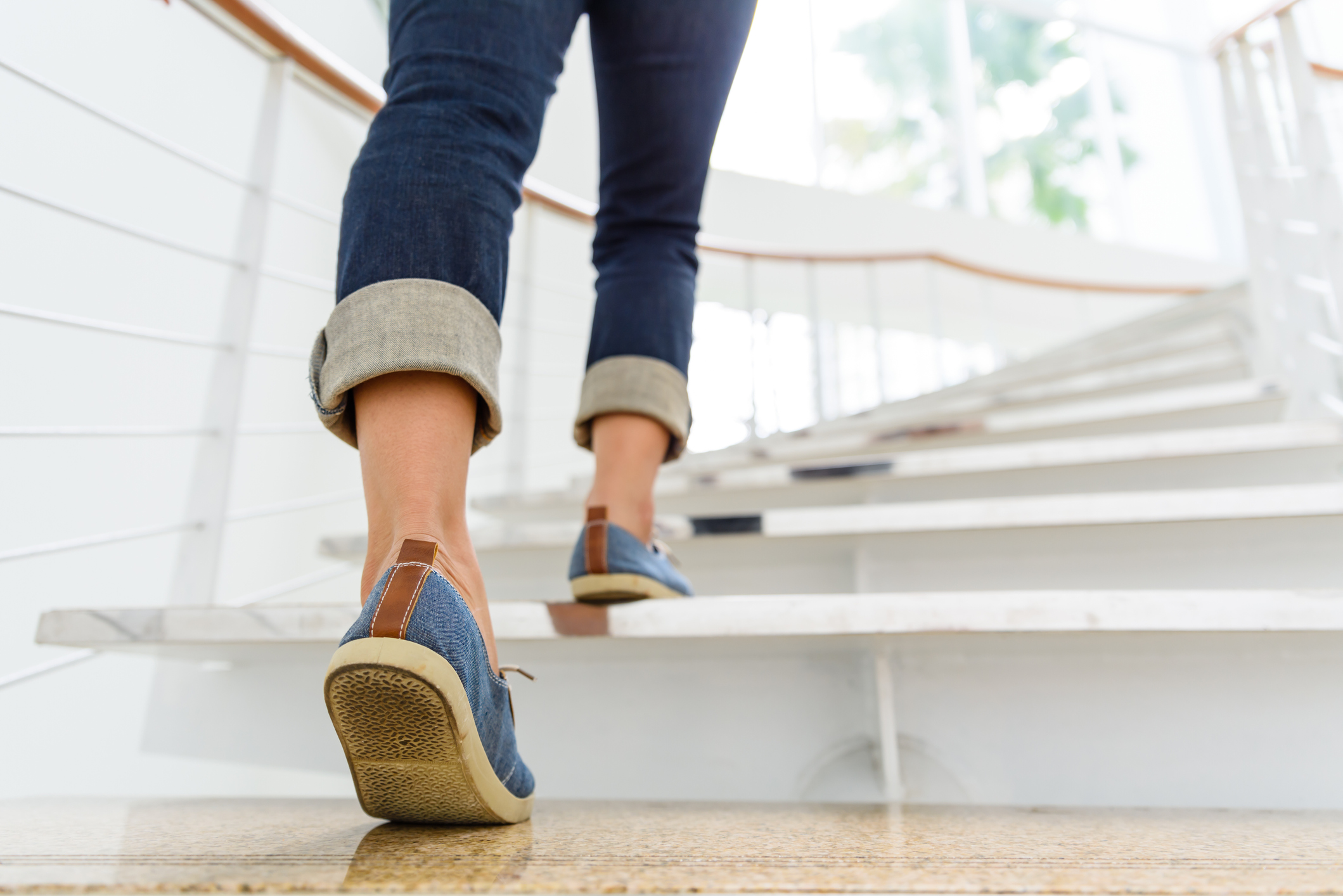 Senior businessman walking up stairs