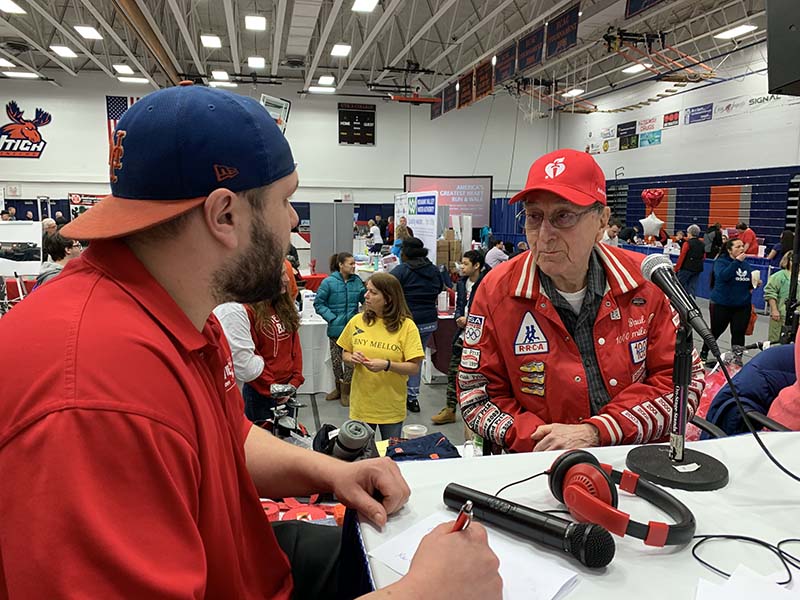 Jeff Monaski, left, brand manager of WIBX, and Paul Ohlbaum, one of the first runners in the 1971 event, chat during a past Radiothon at America’s Greatest Heart Run & Walk. This year's event is sponsored by Slocum-Dickson Medical Group.