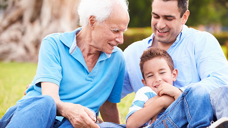 man with father and son at park