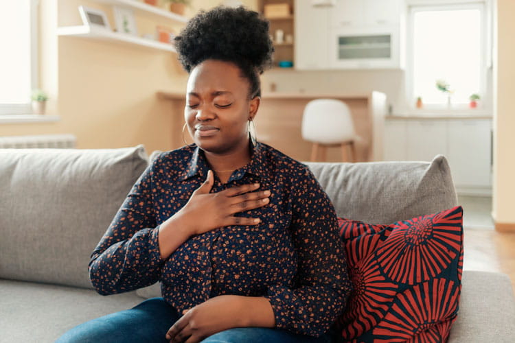 woman with chest discomfort