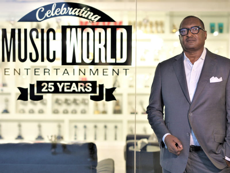 Mathew Knowles at his office in Houston. He was diagnosed this summer with breast cancer and a genetic mutation that puts him at risk for other types of cancer. (Photo by Anzola Media for AHA News)