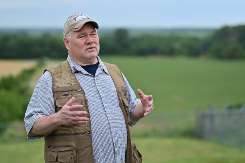 Lance Foster, tribal historic preservation officer and former vice chair for the Iowa Tribe of Kansas and Nebraska, stands atop a burial mound site dating from 1200 to 1400. (Photo by Walter Johnson Jr./American Heart Association)