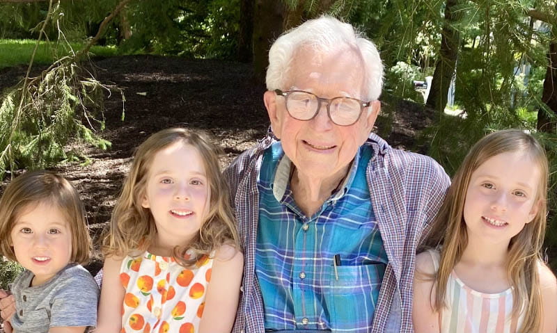 Dr. Eugene Braunwald enjoys a visit in June 2024 from his great-grandchildren, from left, Beni, Elena and Nina, who was named after her great-grandmother Dr. Nina Starr Braunwald. (Photo courtesy of the Braunwald family)