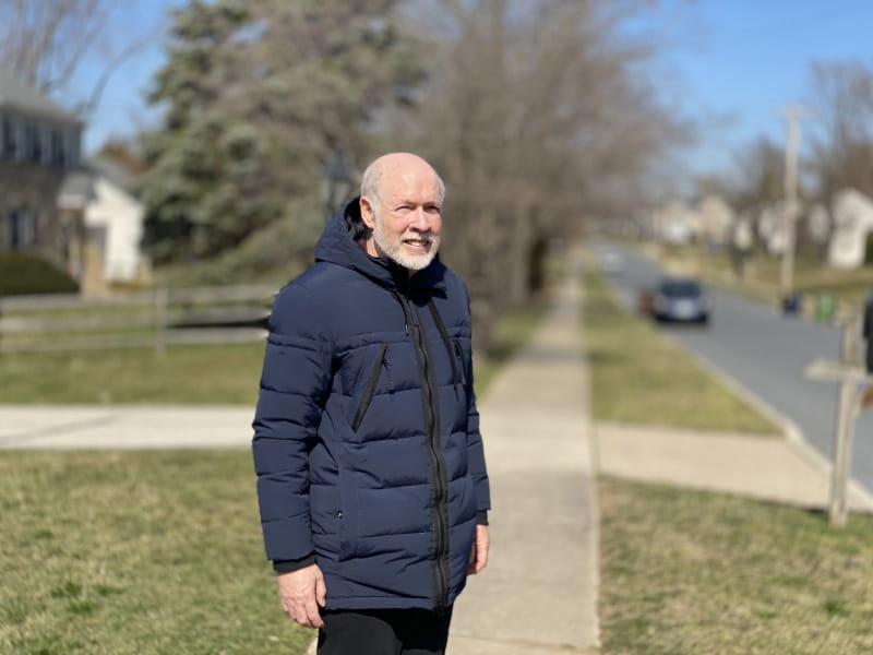 Justin Stroh on the same sidewalk he was shoveling in 2021 when he went into cardiac arrest. (Photo courtesy of Justin Stroh)