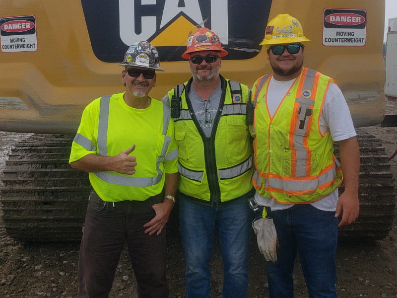 Heart attack survivor Peter Denton (center) with his father, Greg, and son, Hunter. (Photo courtesy of Peter Denton)