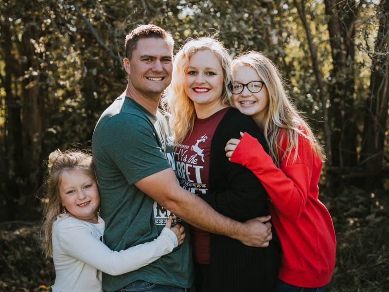 Heart disease survivor Ashley Breaux with her family. From left: daughter Charlotte Breaux-Purtle, partner Brandon Purtle, Ashley and daughter Claire Breaux. (Photo courtesy of Ashley Breaux)