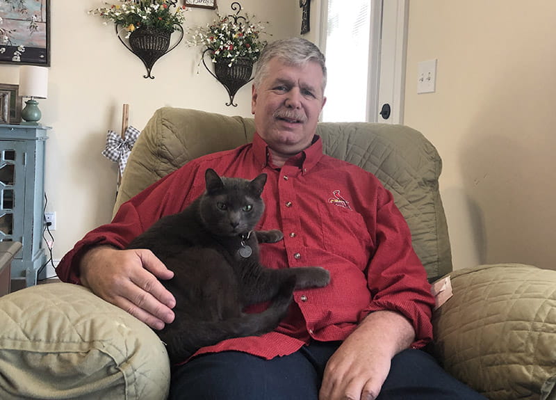 John Cathey with his cat, Rhett Butler. (Photo courtesy of John and Paula Cathey)