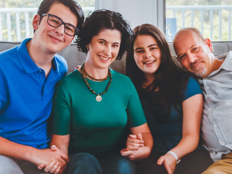 Stroke survivor Allison Zmuda with her family. From left: Cuda, Allison, Zoe and Tom. (Photo courtesy of Annie Sykes)