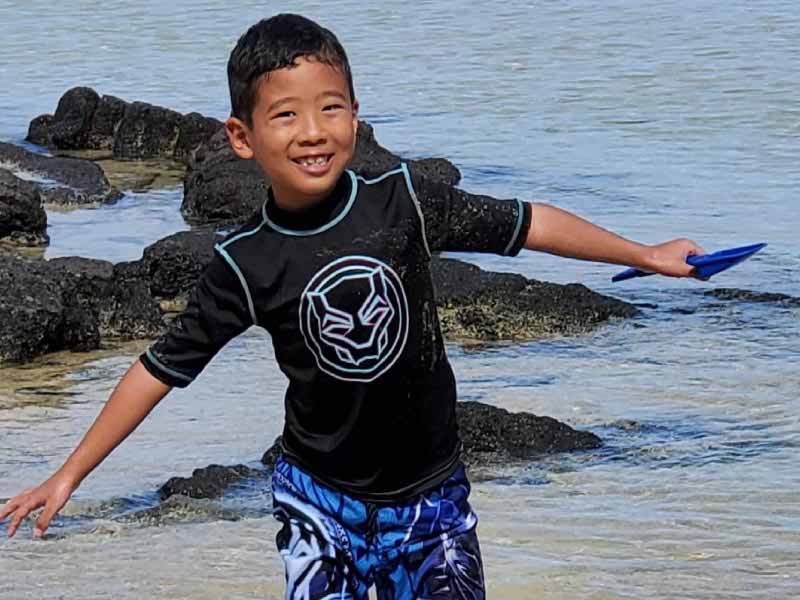 Heart failure survivor Jase Tawata at Onekahakaha Beach in Hilo, HI. (Photo courtesy of Stephanie Tawata)