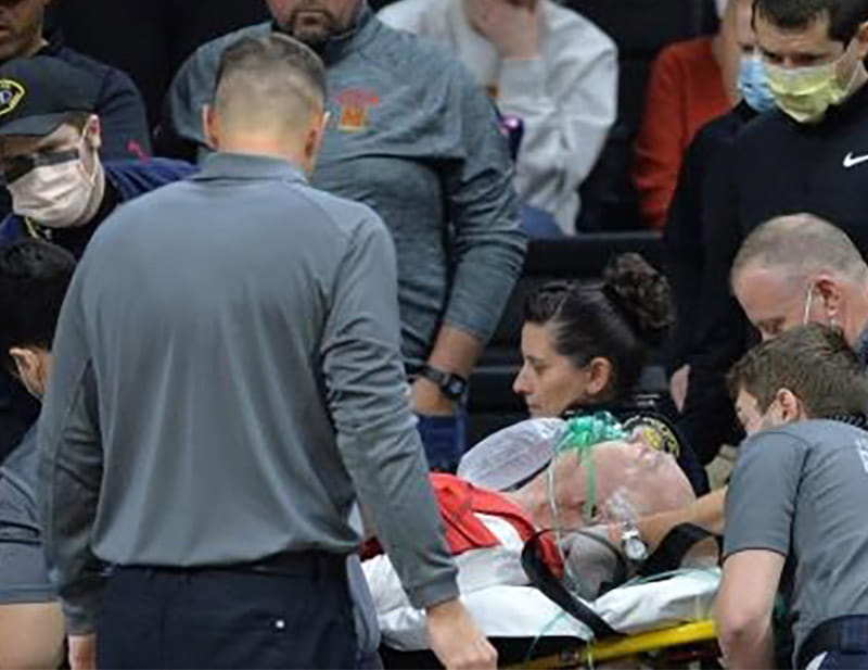 Stan Goldstein on a stretcher in the University of Iowa basketball arena after he went into cardiac arrest. (Photo courtesy of Stan Goldstein)