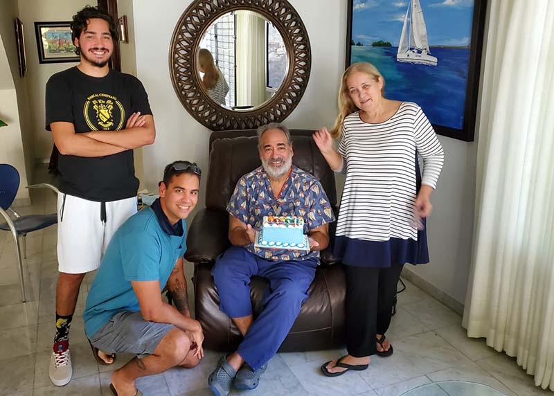 Davila and family enjoy a belated birthday cake. (Photo courtesy of Dr. Angel Davila)