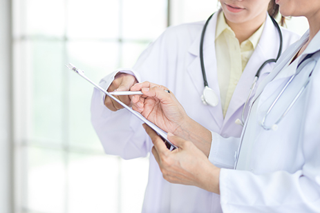 doctors looking at clipboard
