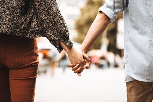 Couple holding hands