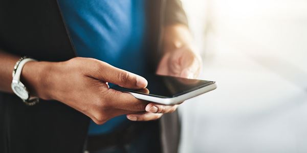 close up of hands using cell phone close up of hands using cell phone