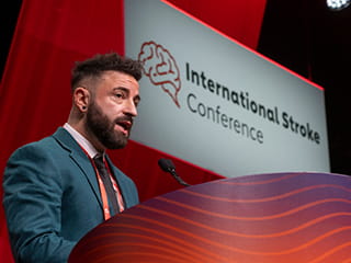 A speaker talking at the podium at the International Stroke Conference