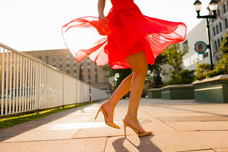 close up of woman's legs dancing in street