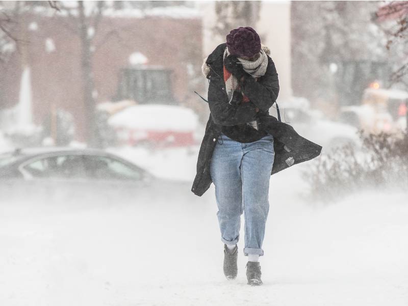 Person walking in blowing snow.