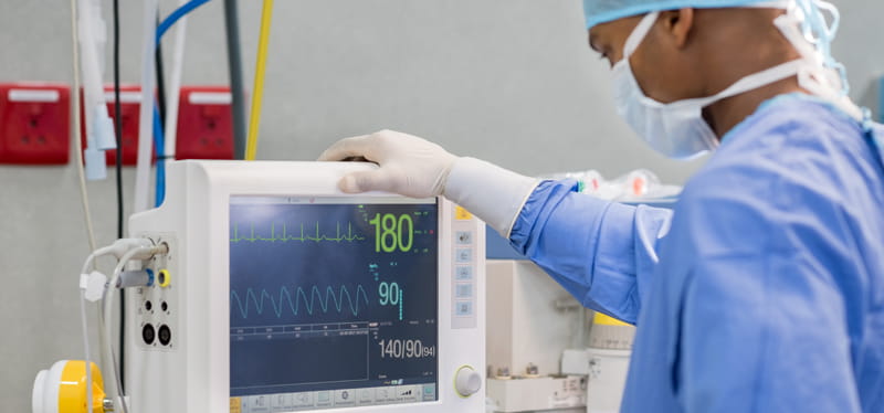 Emergency department worker with heart monitor